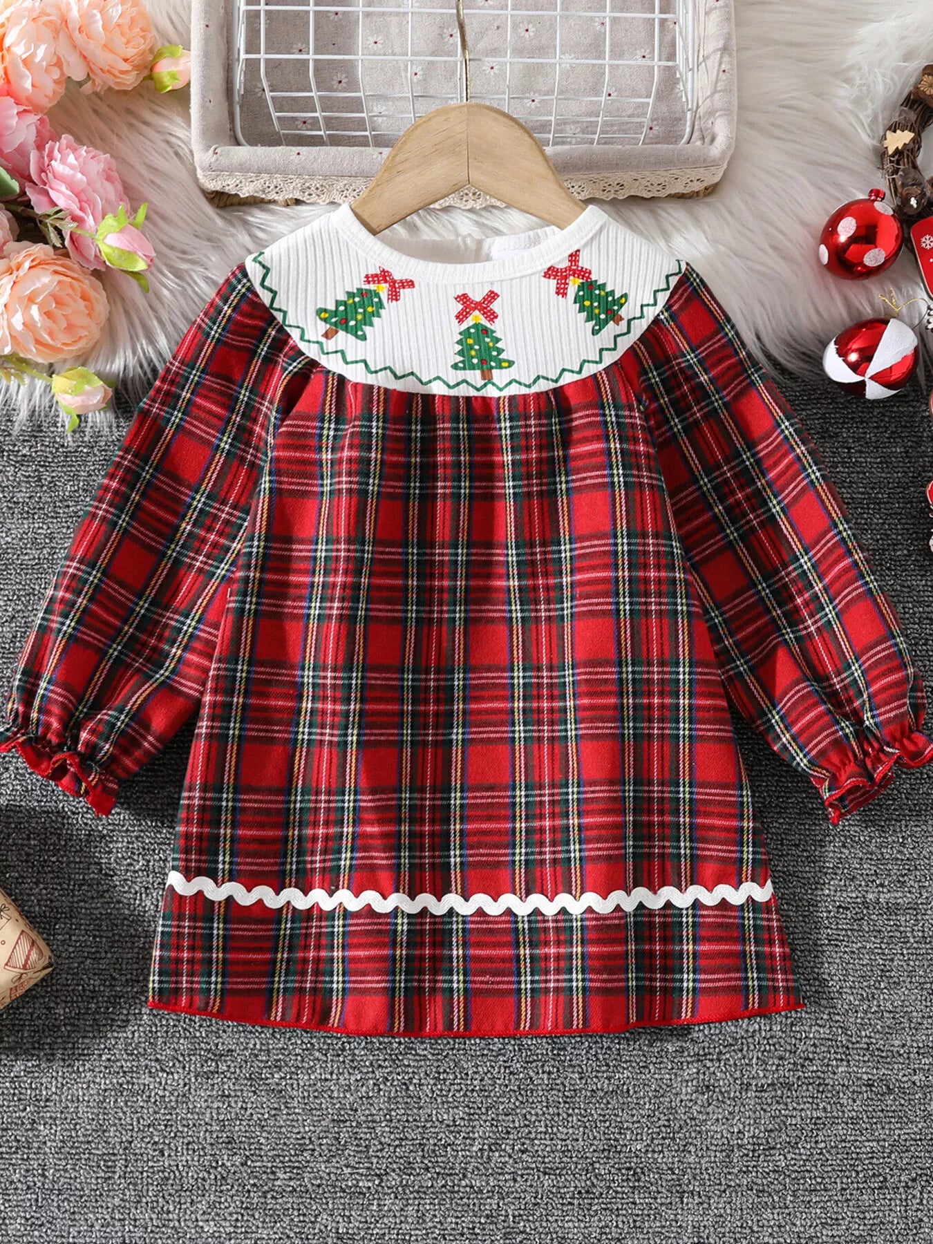 Front view of toddler red plaid Christmas dress with embroidered smocked collar