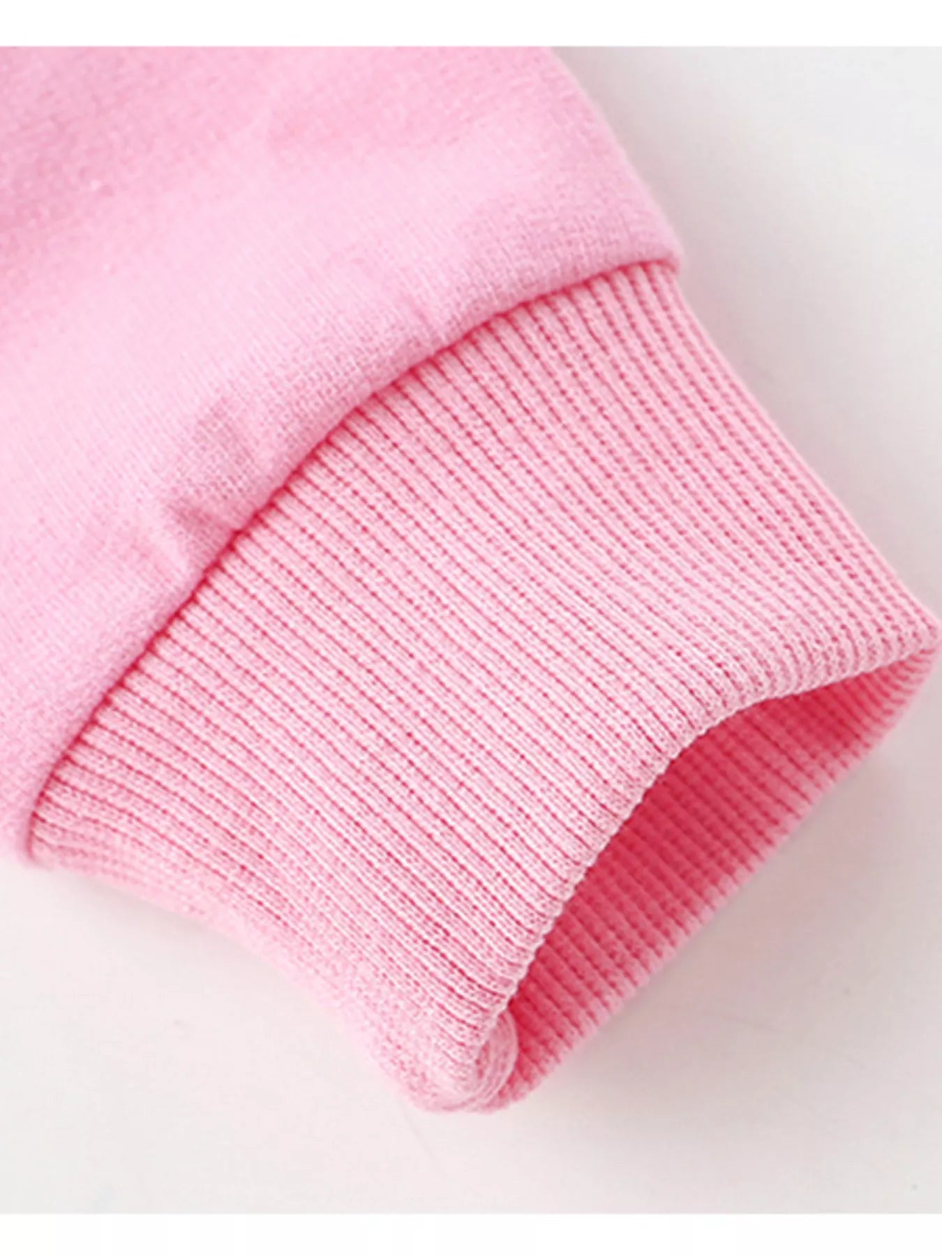 Cute holiday pink cotton sweatshirt with reindeer graphic and star details.