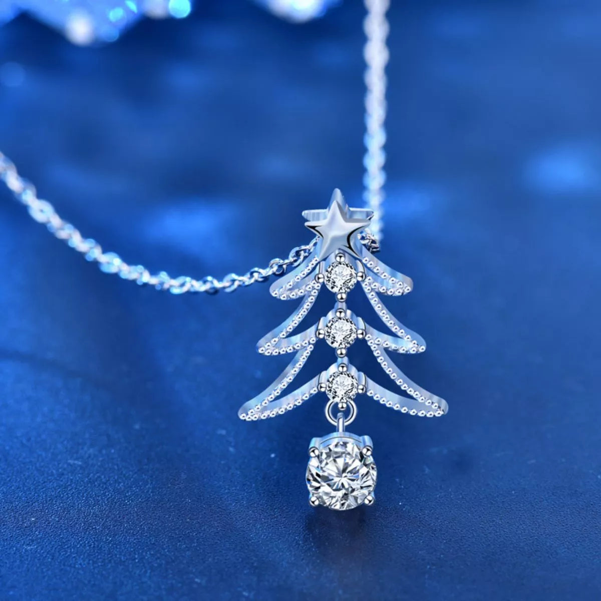 Sparkling sterling silver necklace shaped like a holiday tree with star top