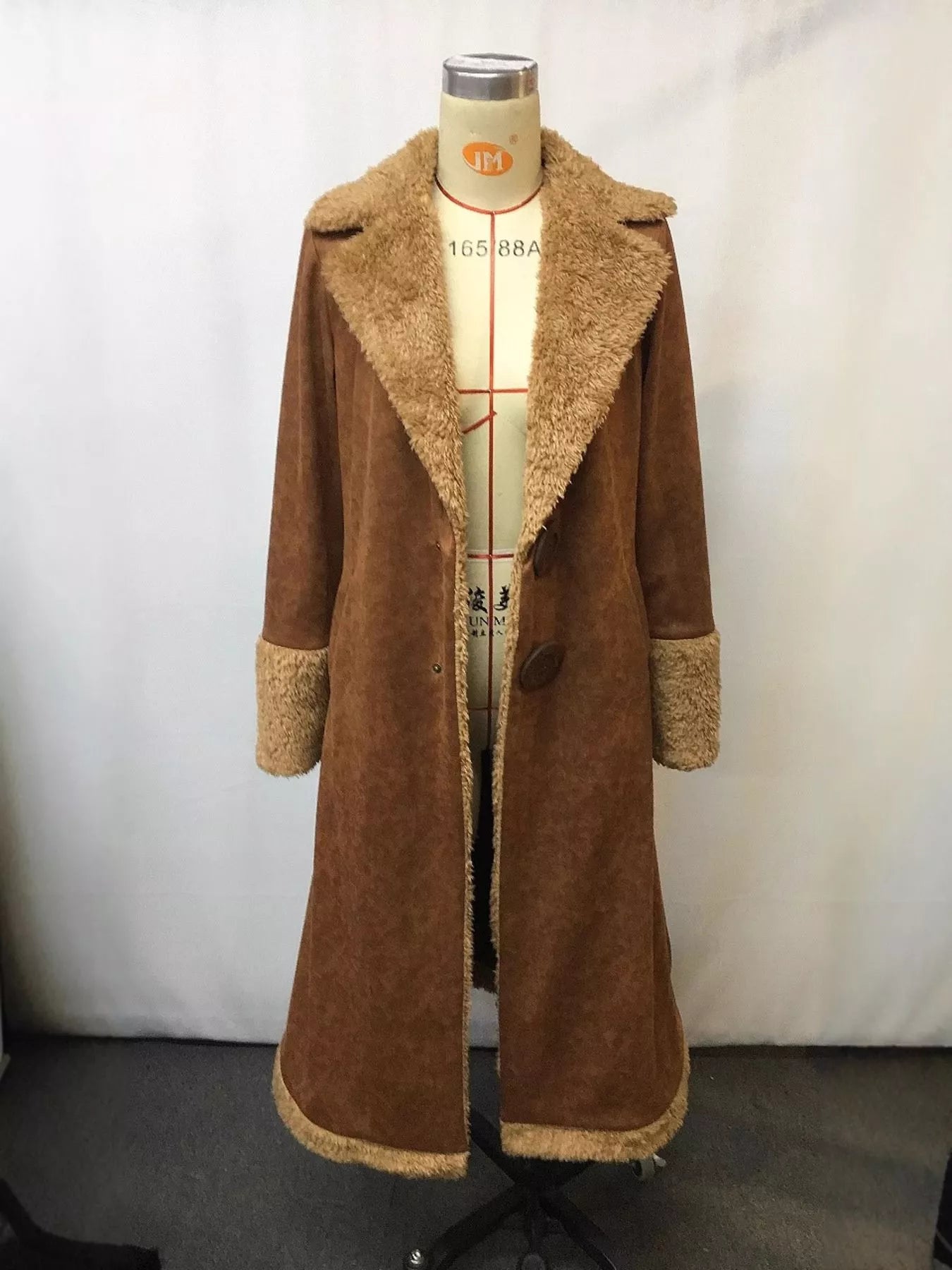 Western-inspired long coat with oversized sherpa collar and cuffs