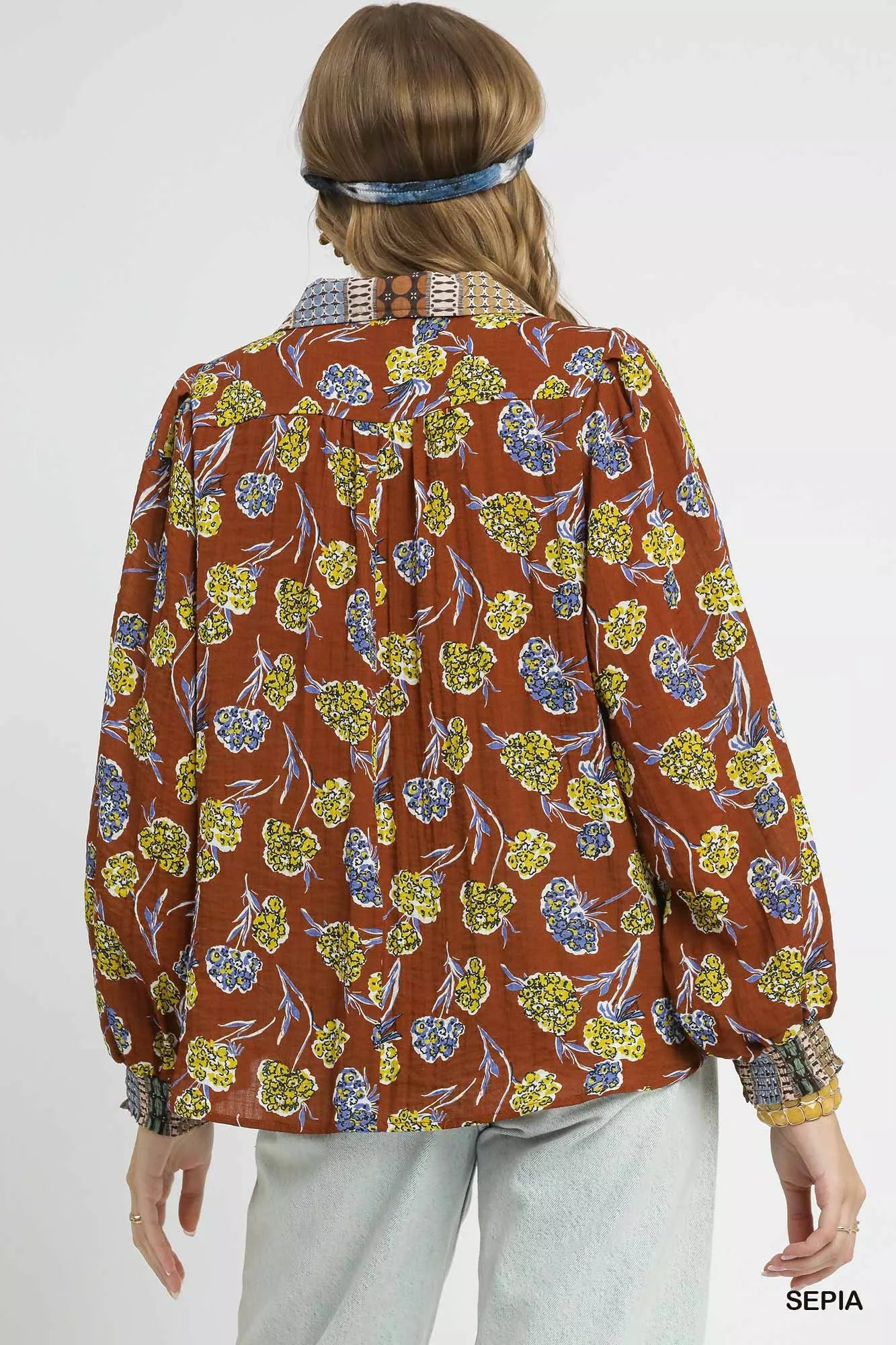 Boho floral print blouse in warm brown with contrast collar, long balloon sleeves, and relaxed fit on model