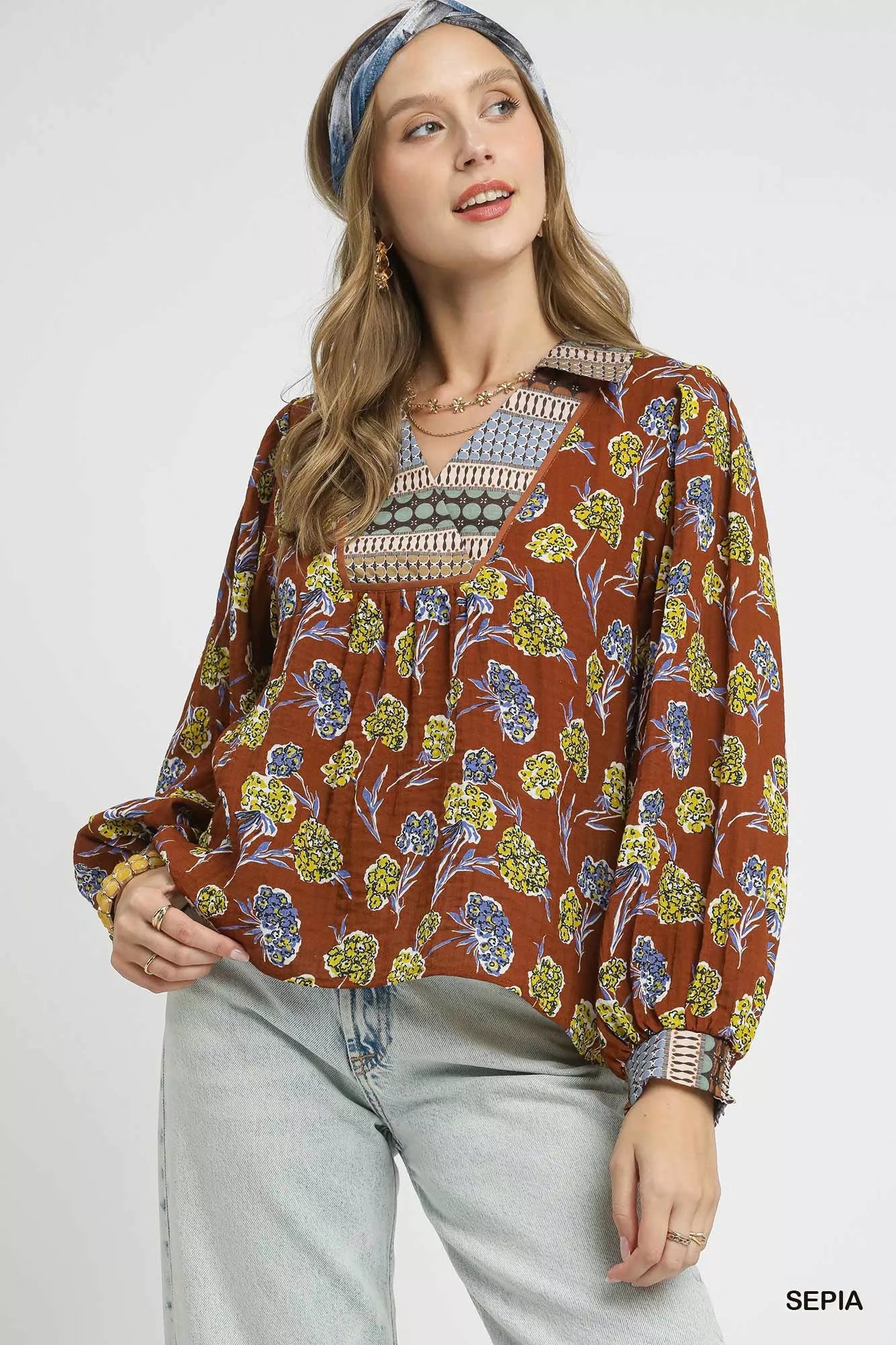 Boho floral print blouse in warm brown with contrast collar, long balloon sleeves, and relaxed fit on model
