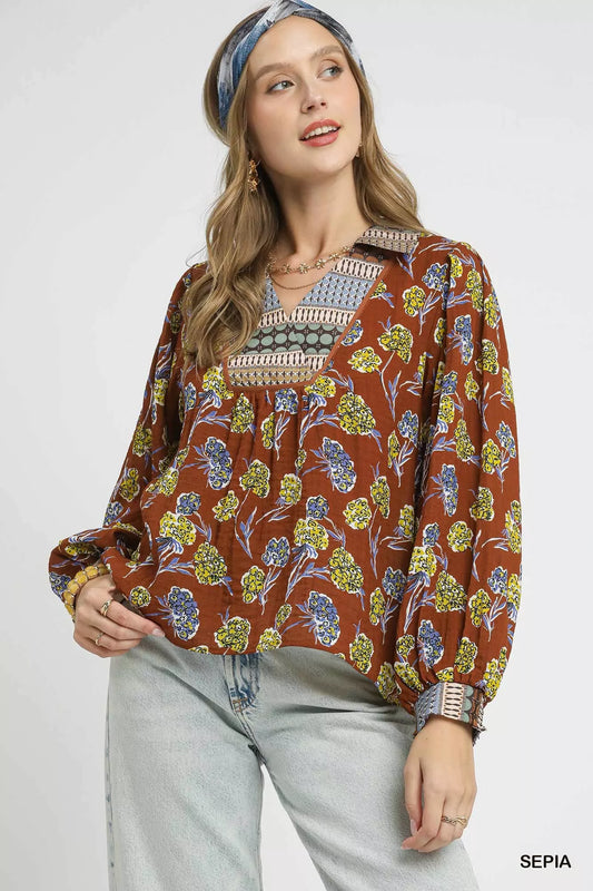 Boho floral print blouse in warm brown with contrast collar, long balloon sleeves, and relaxed fit on model