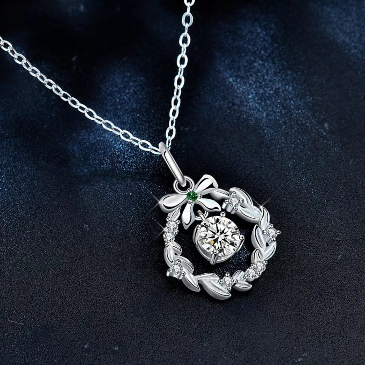 Elegant Christmas wreath necklace with bow and gemstone details