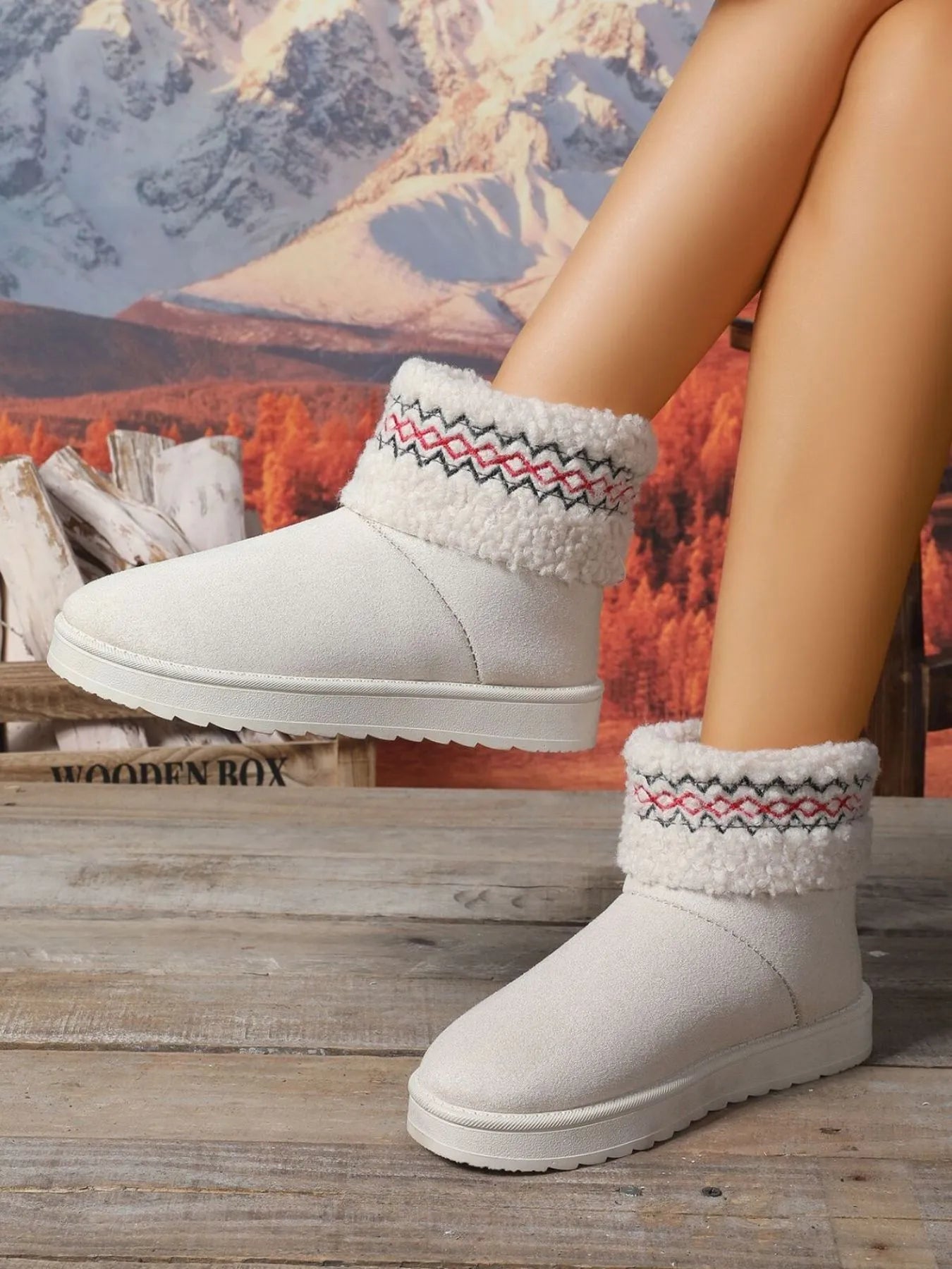 Woman wearing knit cuff winter booties in black, tan, and cream — cozy cold-weather shoes from A Whimsical Affair.