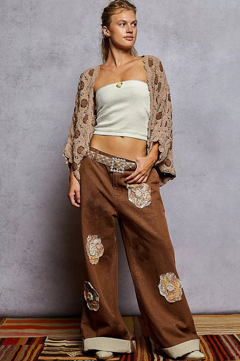 Brown crochet chenille cardigan with floral pattern and relaxed batwing fit.