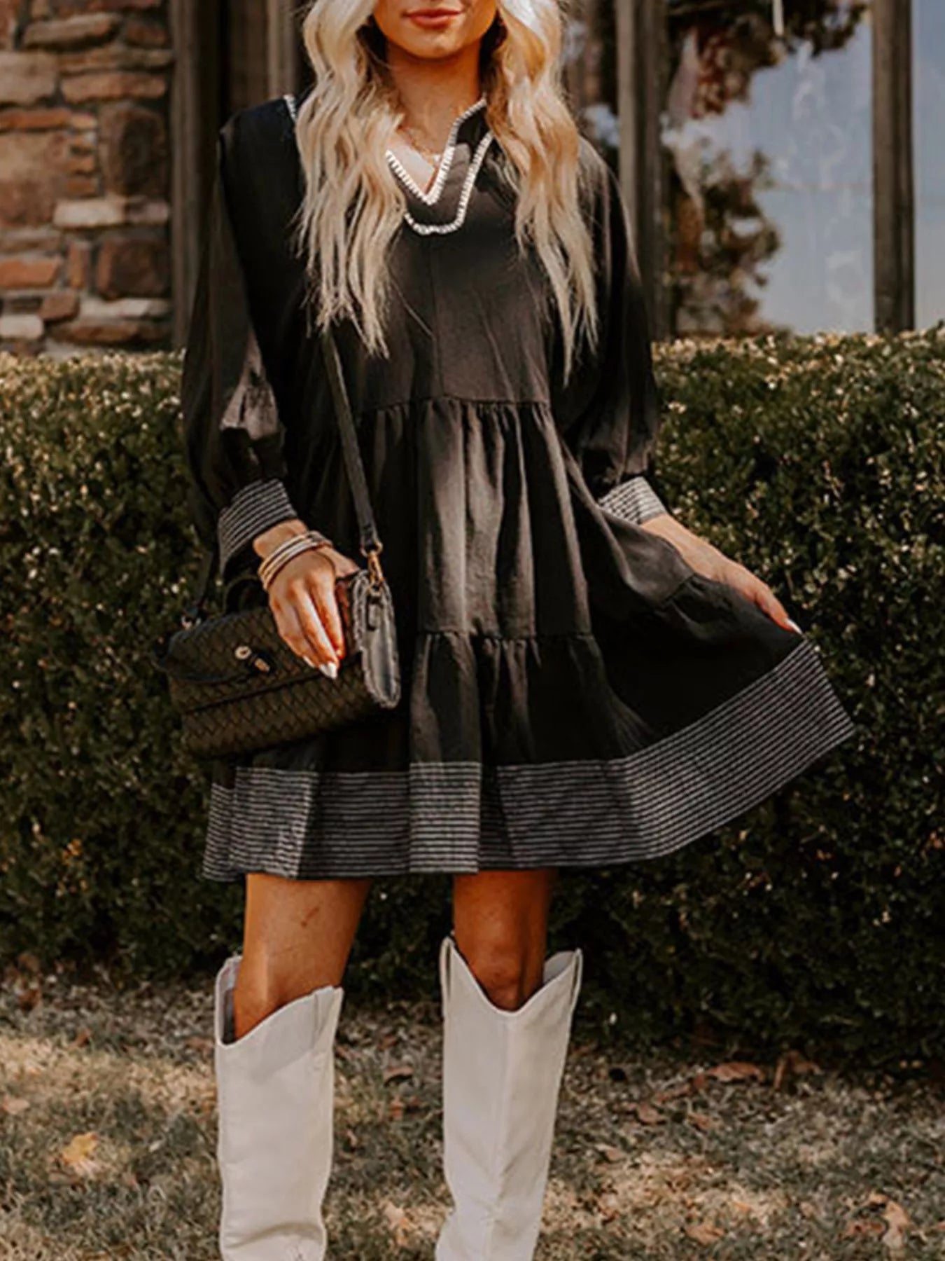 Woman wearing brown Autumn Ease Tiered Dress with 3/4 sleeves and striped hem