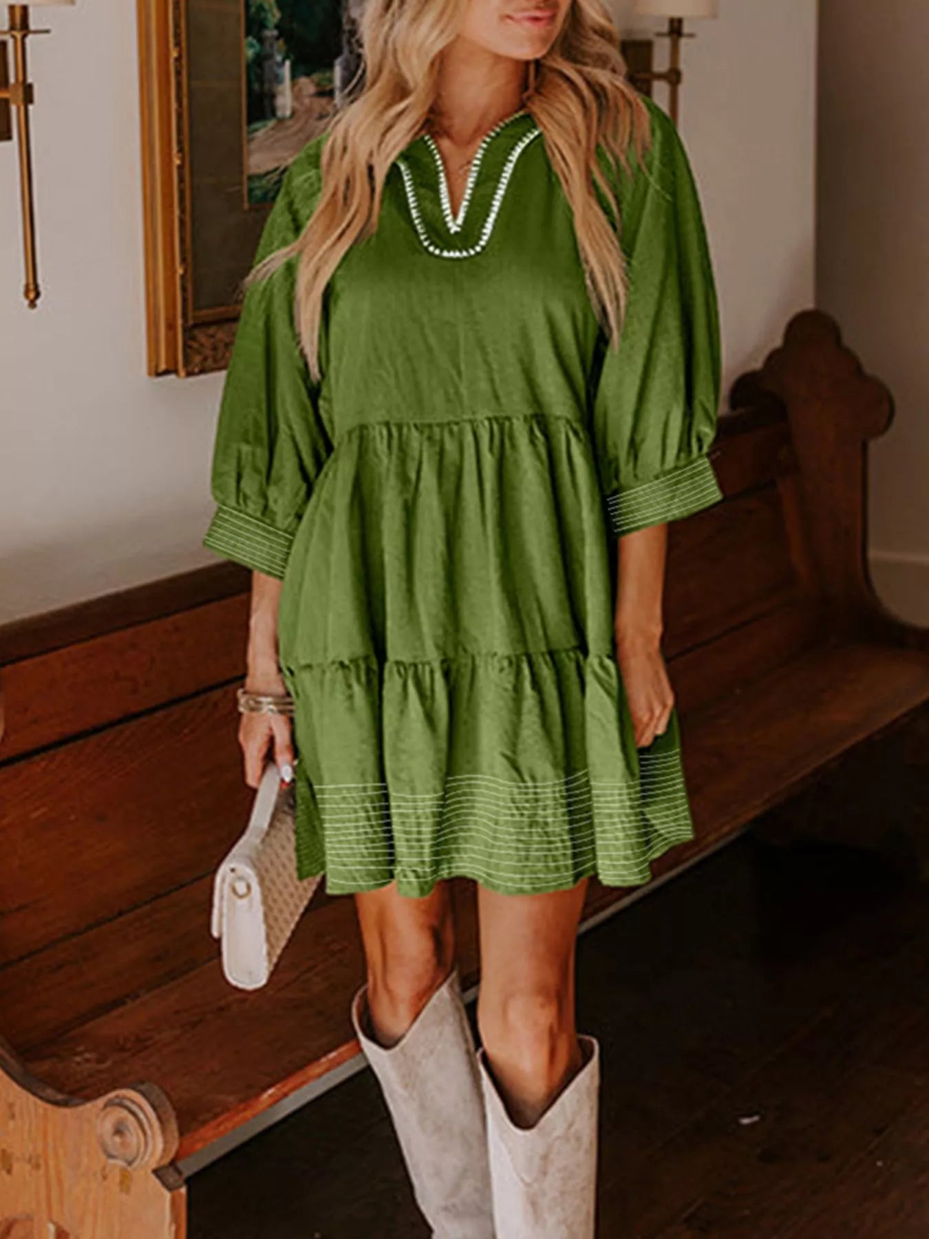 Woman wearing green Autumn Ease Tiered Dress with 3/4 sleeves and striped hem