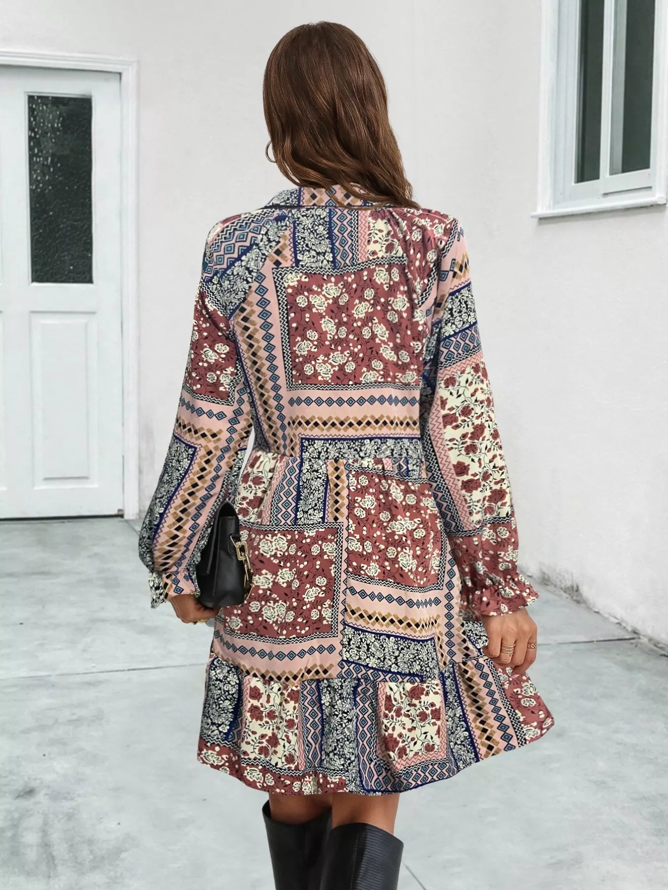 Patchwork long sleeve mini dress with ruffled hem and boho-inspired print
