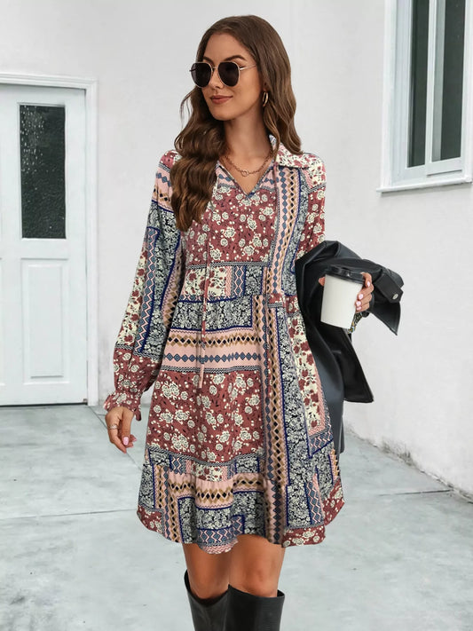 Patchwork long sleeve mini dress with ruffled hem and boho-inspired print