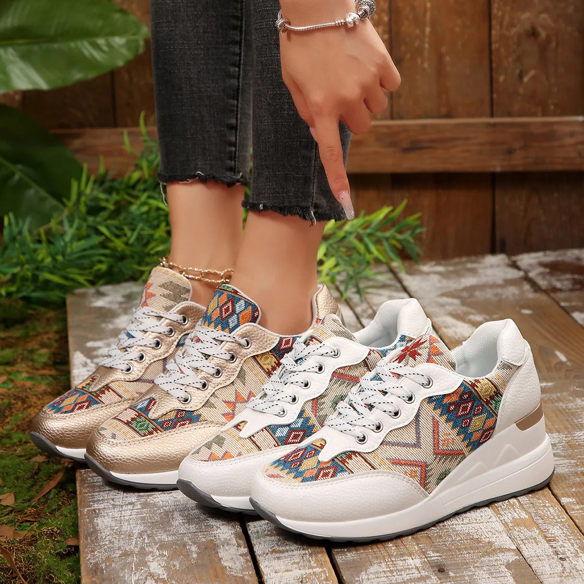 A pair of Aztec Rise Wedge Sneakers with colorful geometric patterns, lace-up design, and hidden wedge heel in cream and khaki color options