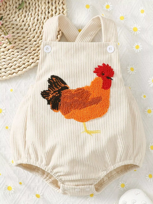 Cream ribbed corduroy baby romper with button straps, snap bottom, and textured chicken appliqué on the front.