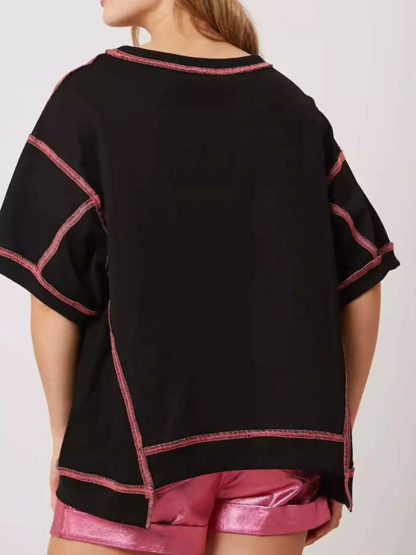 Oversized black tee with pink glitter lobster print and contrast stitching.