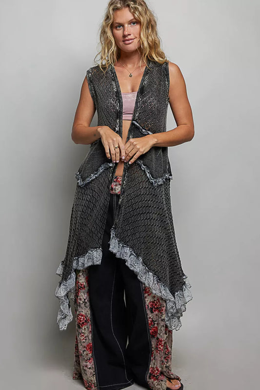 Sleeveless crochet vest with openwork texture, lace details, cascading ruffle hem, and lightweight boho layering style.