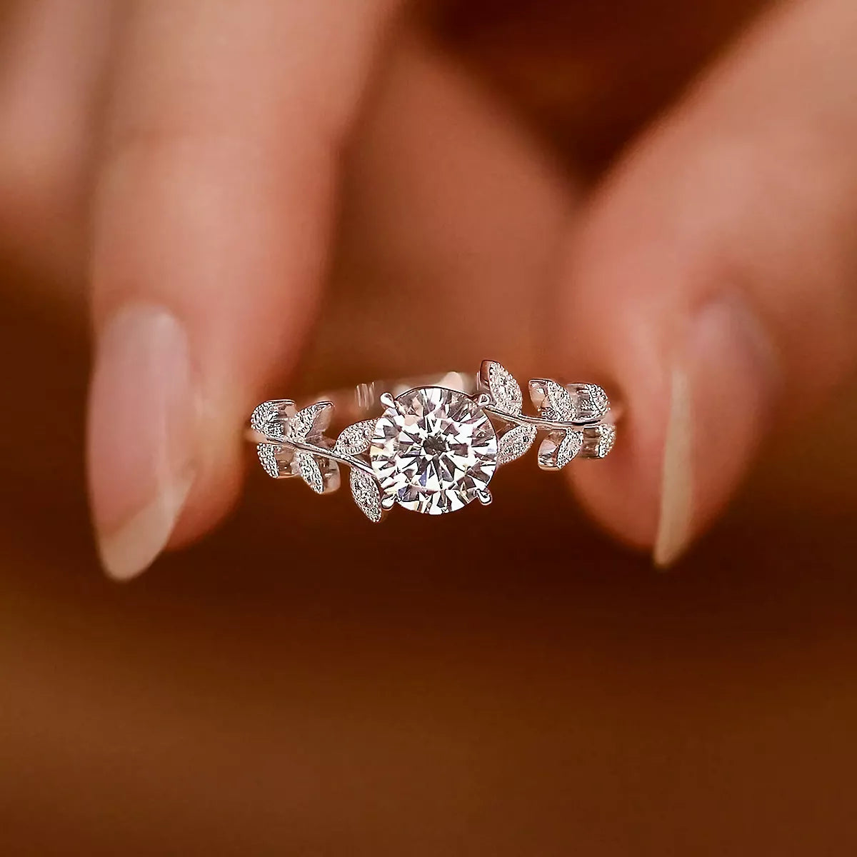 Blooming Rose Sterling Silver Ring with zircon centerpiece and delicate leaf accents on finger