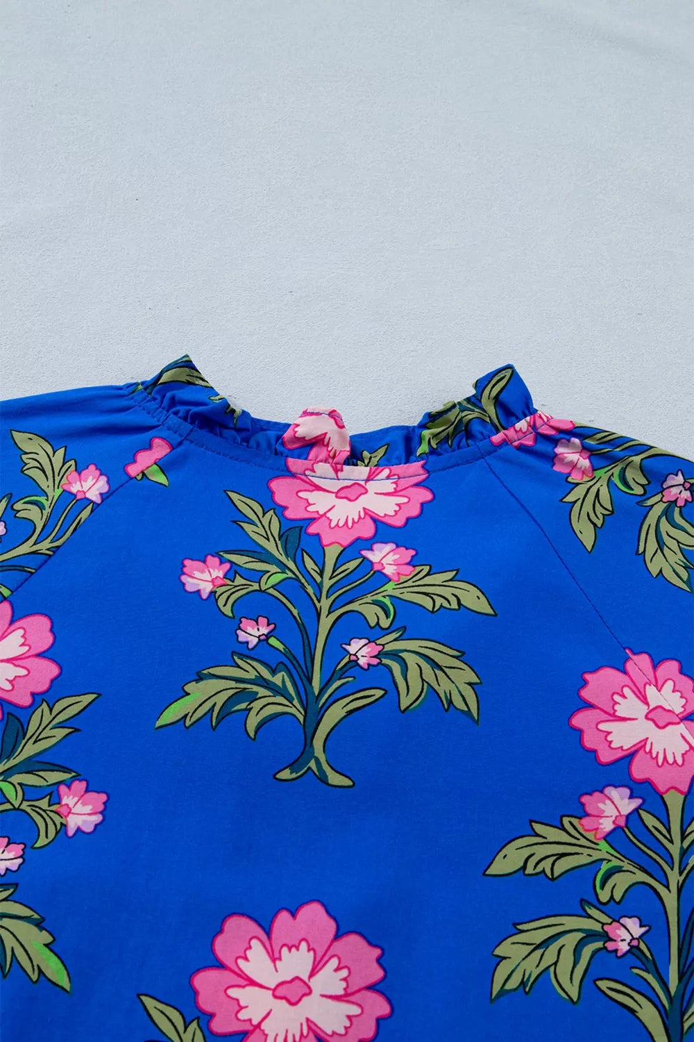 Floral tiered dress with flutter sleeves and tie neckline
