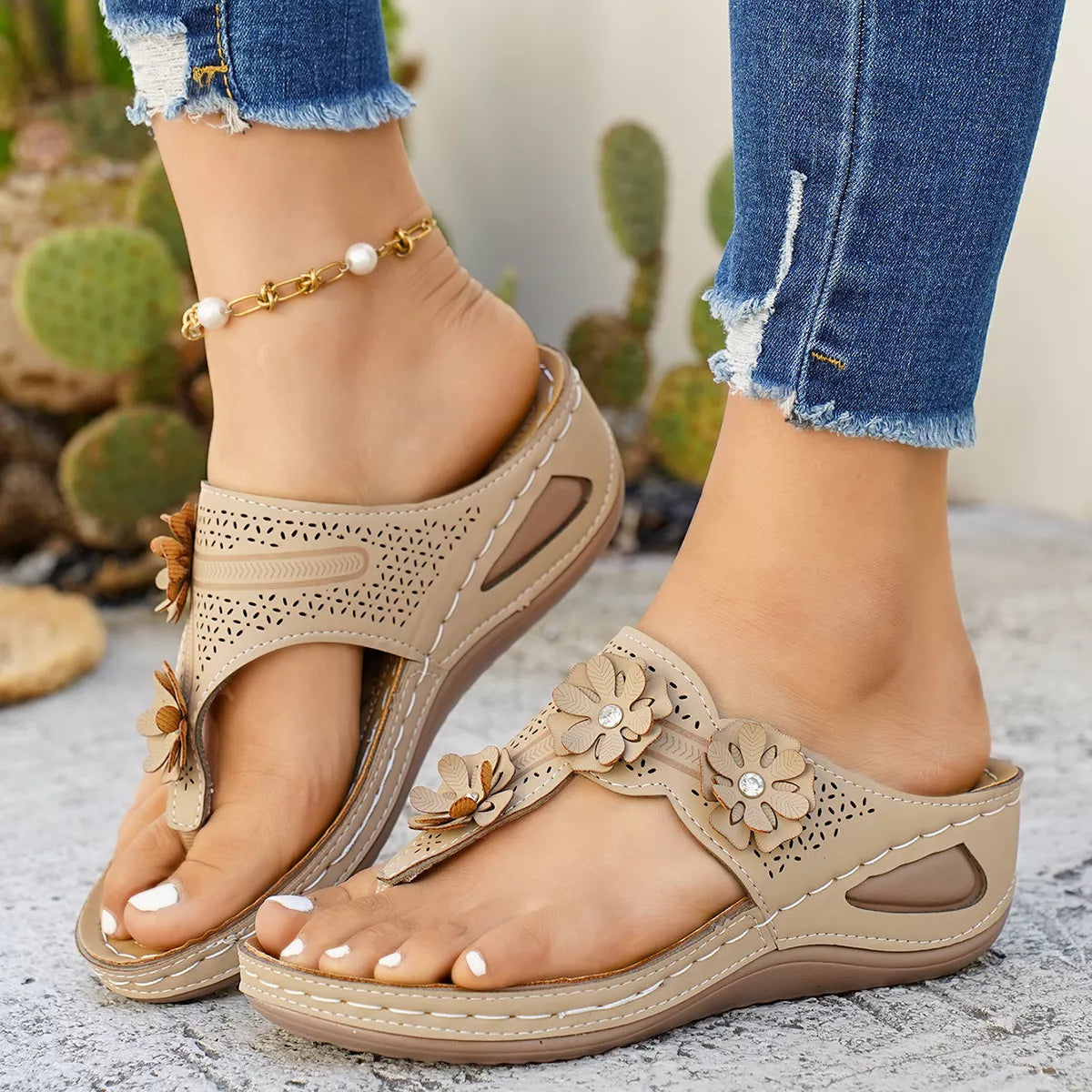 Low heel slip-on thong sandals with floral appliqué details, cutout accents, PU leather material, and rubber sole shown in multiple colors.