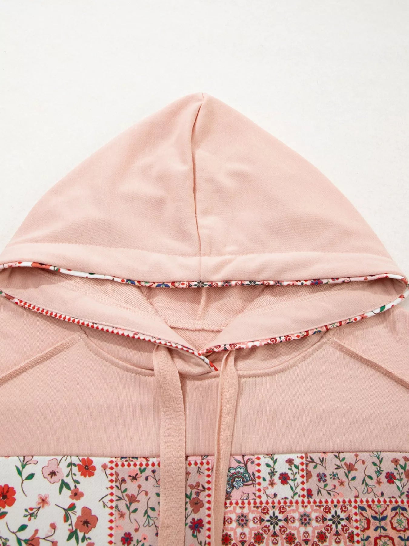 Blossom Path Hoodie in dusty pink with floral patchwork details and drawstring hood