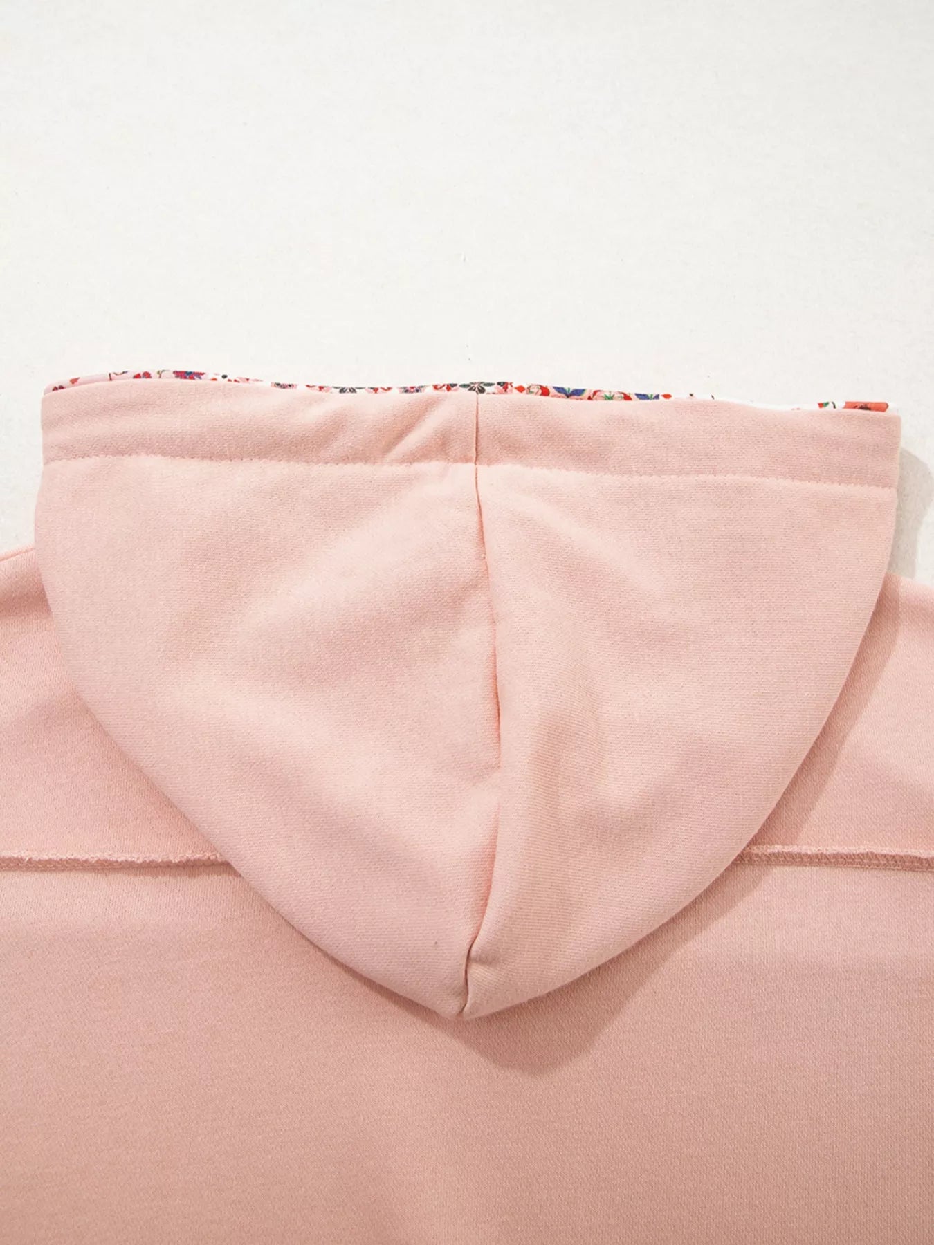 Blossom Path Hoodie in dusty pink with floral patchwork details and drawstring hood