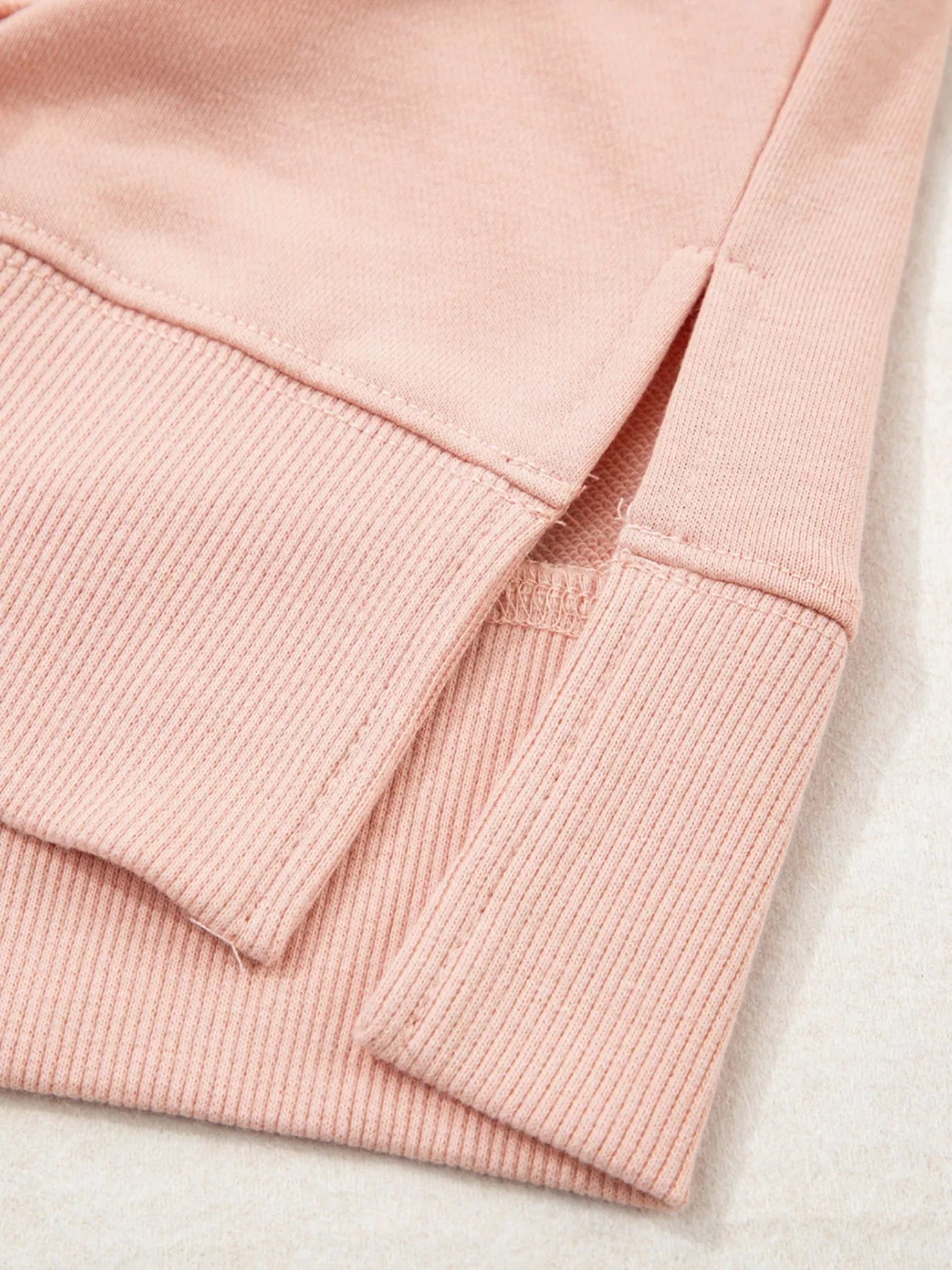 Blossom Path Hoodie in dusty pink with floral patchwork details and drawstring hood