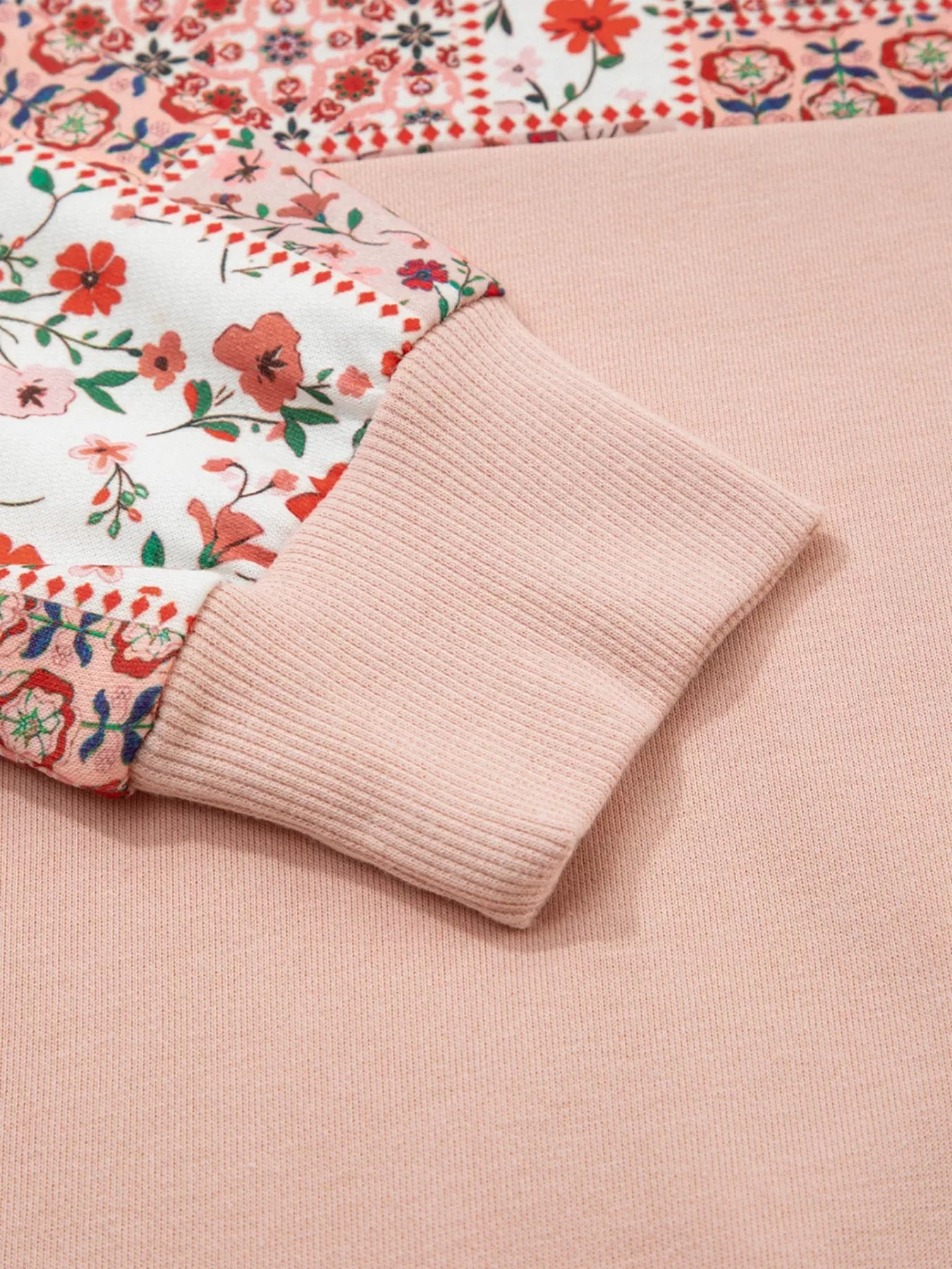 Blossom Path Hoodie in dusty pink with floral patchwork details and drawstring hood