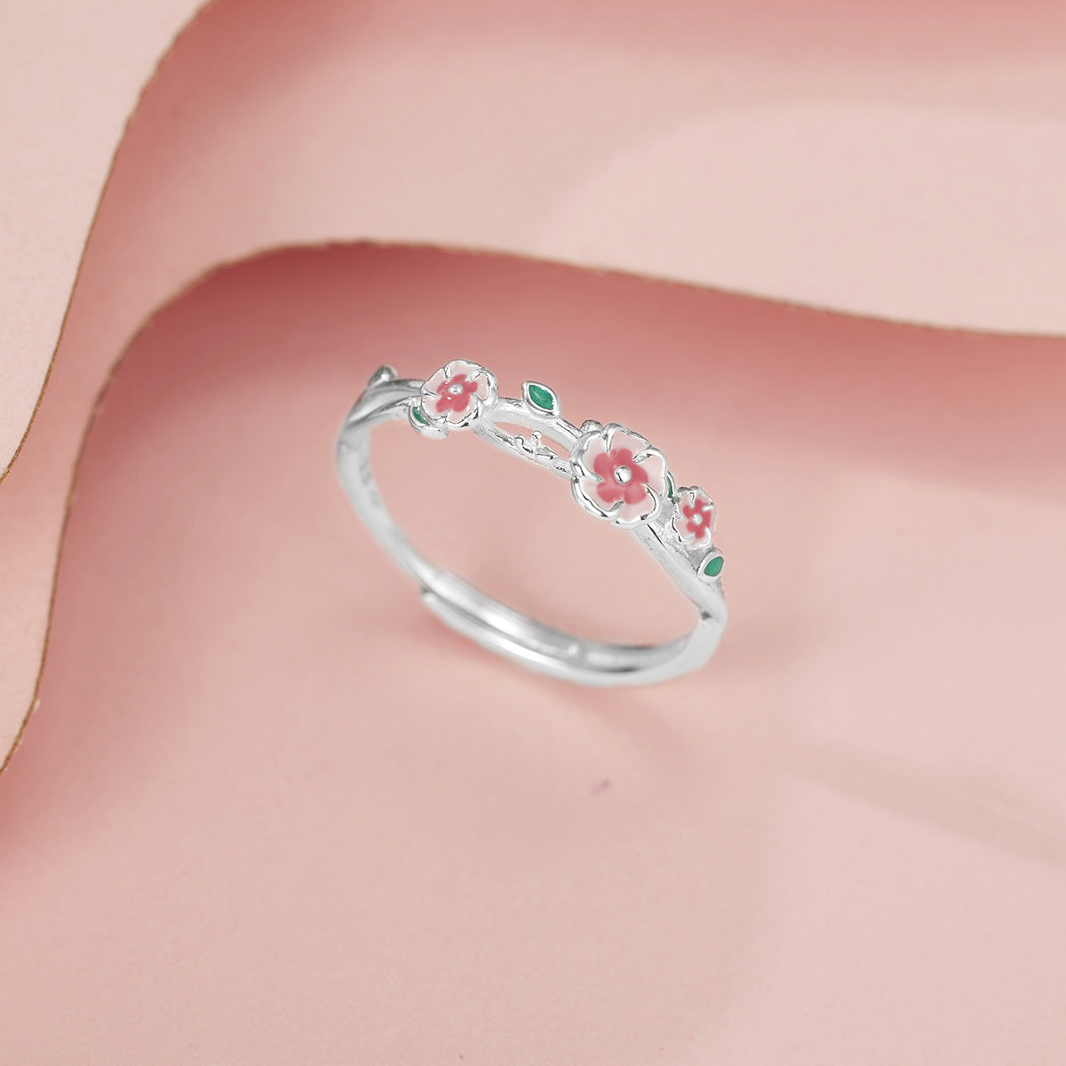18K gold plated and sterling silver floral ring with pink enamel blossoms and green leaf details