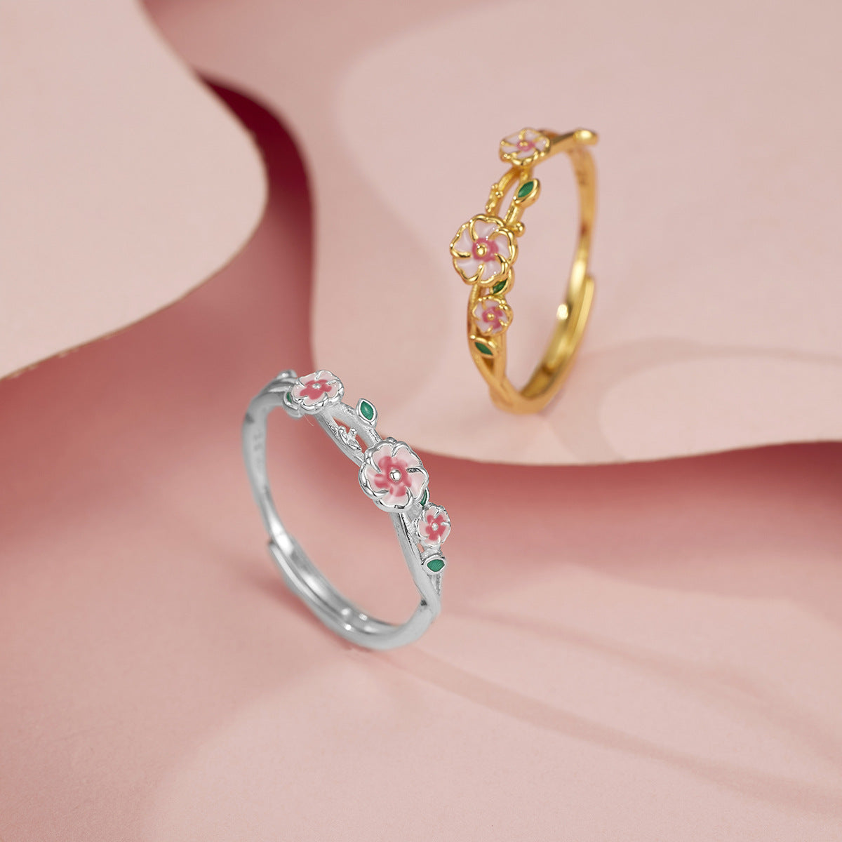 18K gold plated and sterling silver floral ring with pink enamel blossoms and green leaf details