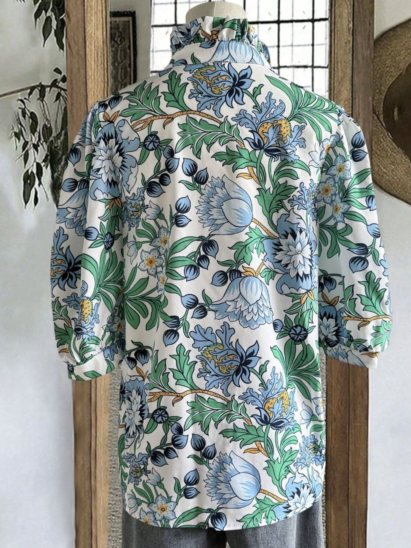 White blouse with blue green floral botanical print and gathered neckline