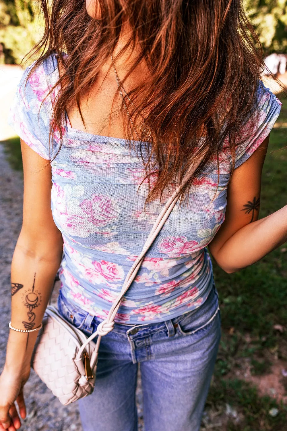 Blue floral ruched mesh top with pink rose print and cap sleeves