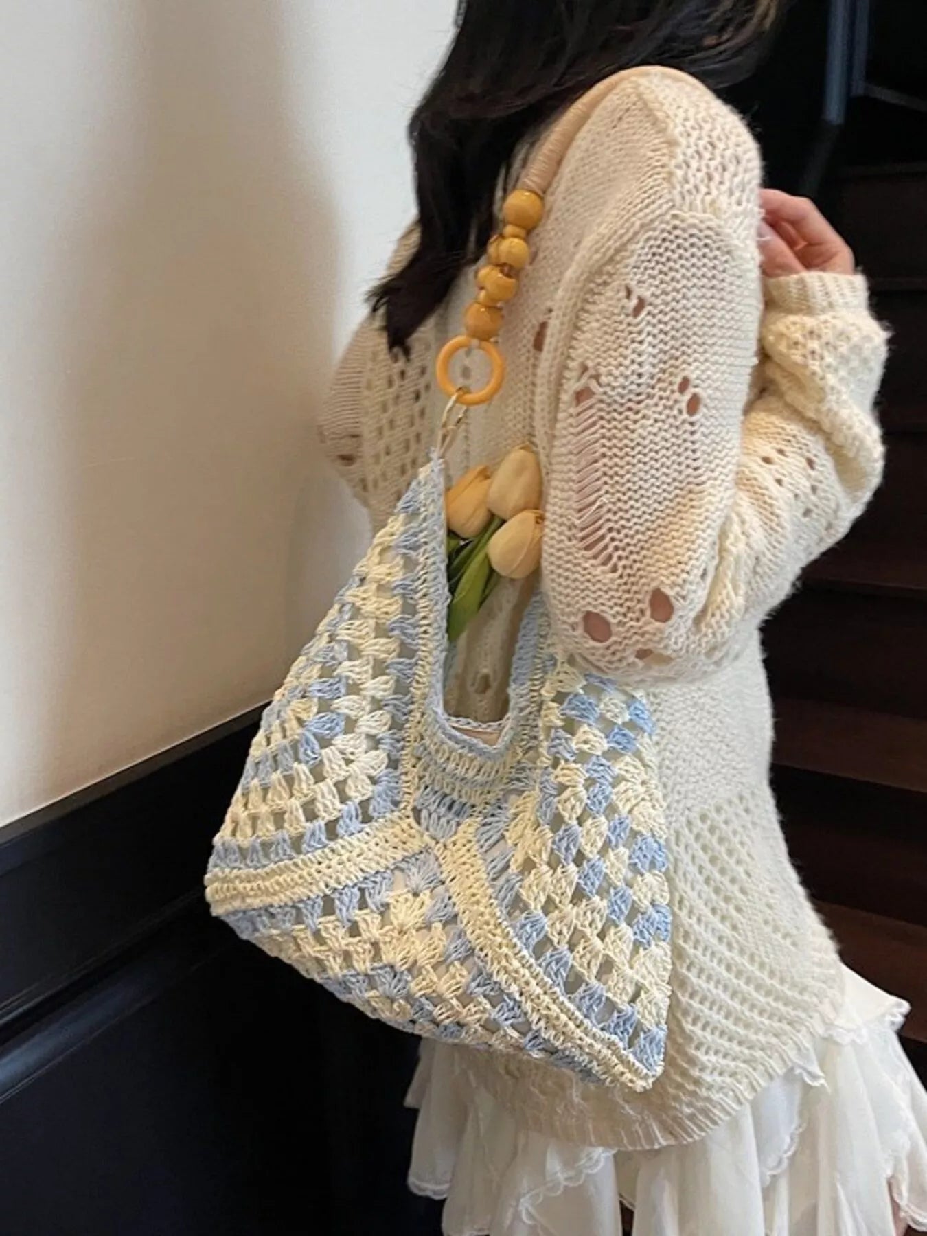 blue and ivory crochet woven tote bag with wooden bead handles and soft boho coastal style