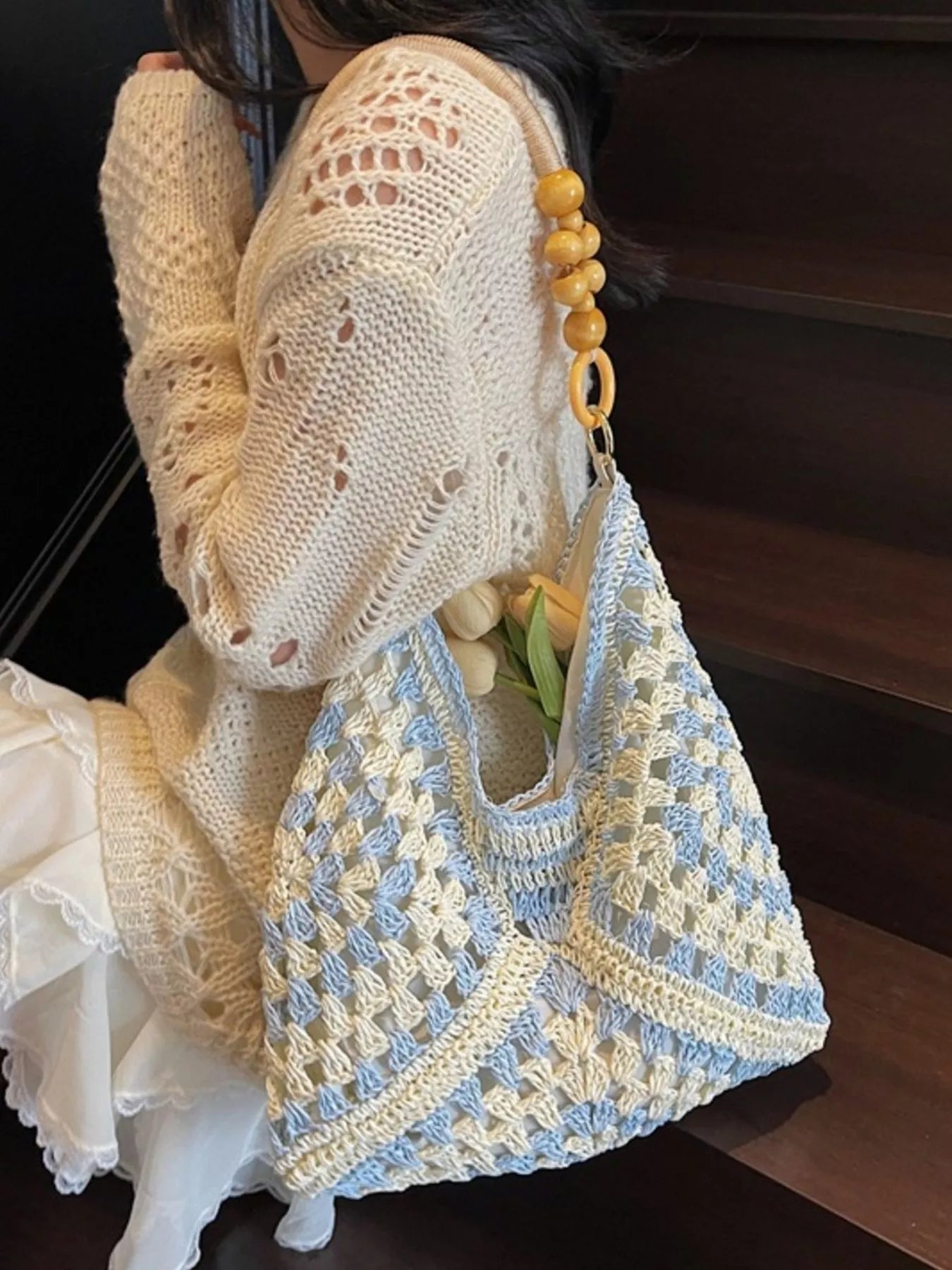 blue and ivory crochet woven tote bag with wooden bead handles and soft boho coastal style
