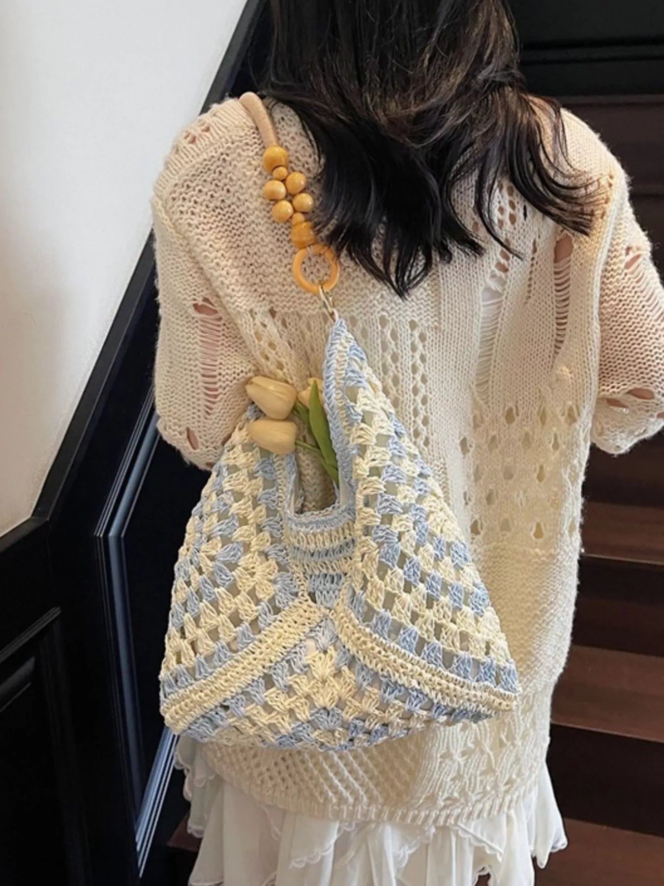 blue and ivory crochet woven tote bag with wooden bead handles and soft boho coastal style