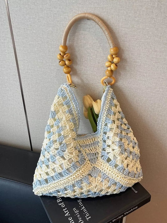 blue and ivory crochet woven tote bag with wooden bead handles and soft boho coastal style