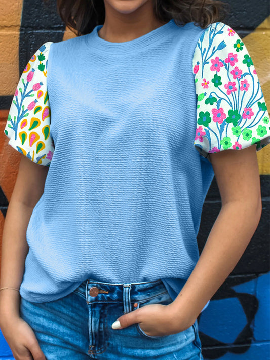 Blue textured top with colorful floral puff sleeves
