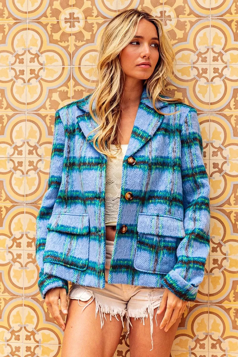 Blue plaid button-front jacket with flap pockets, structured collar, soft brushed texture, and relaxed cropped fit.