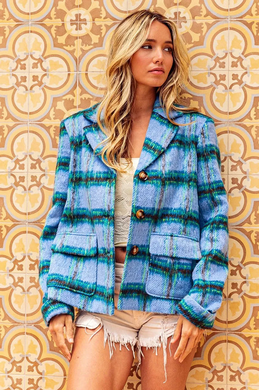 Blue plaid button-front jacket with flap pockets, structured collar, soft brushed texture, and relaxed cropped fit.