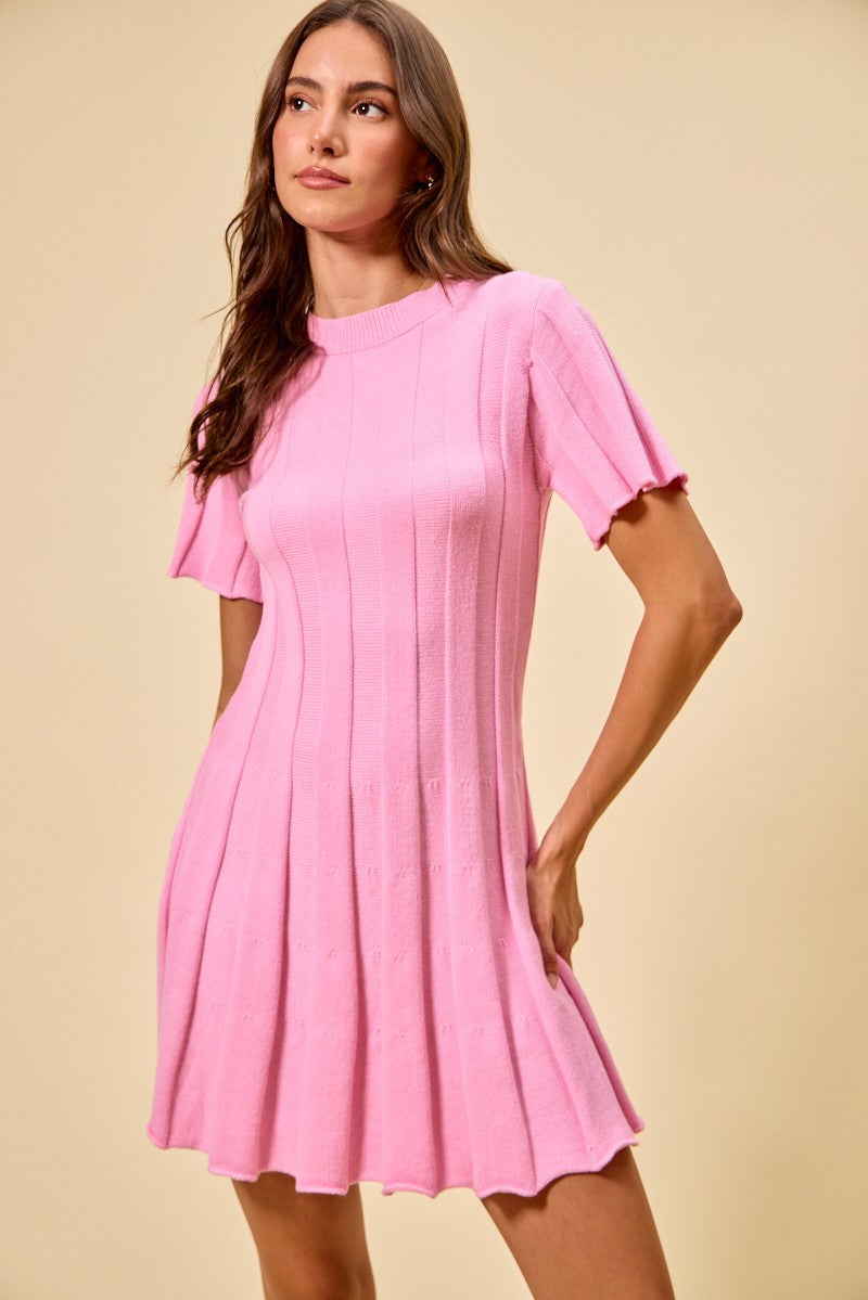 Pink ribbed sweater knit mini dress with short sleeves and flared silhouette