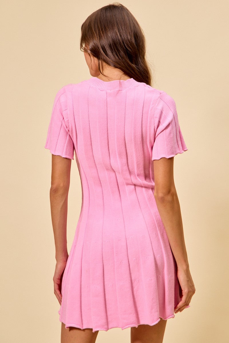 Pink ribbed sweater knit mini dress with short sleeves and flared silhouette