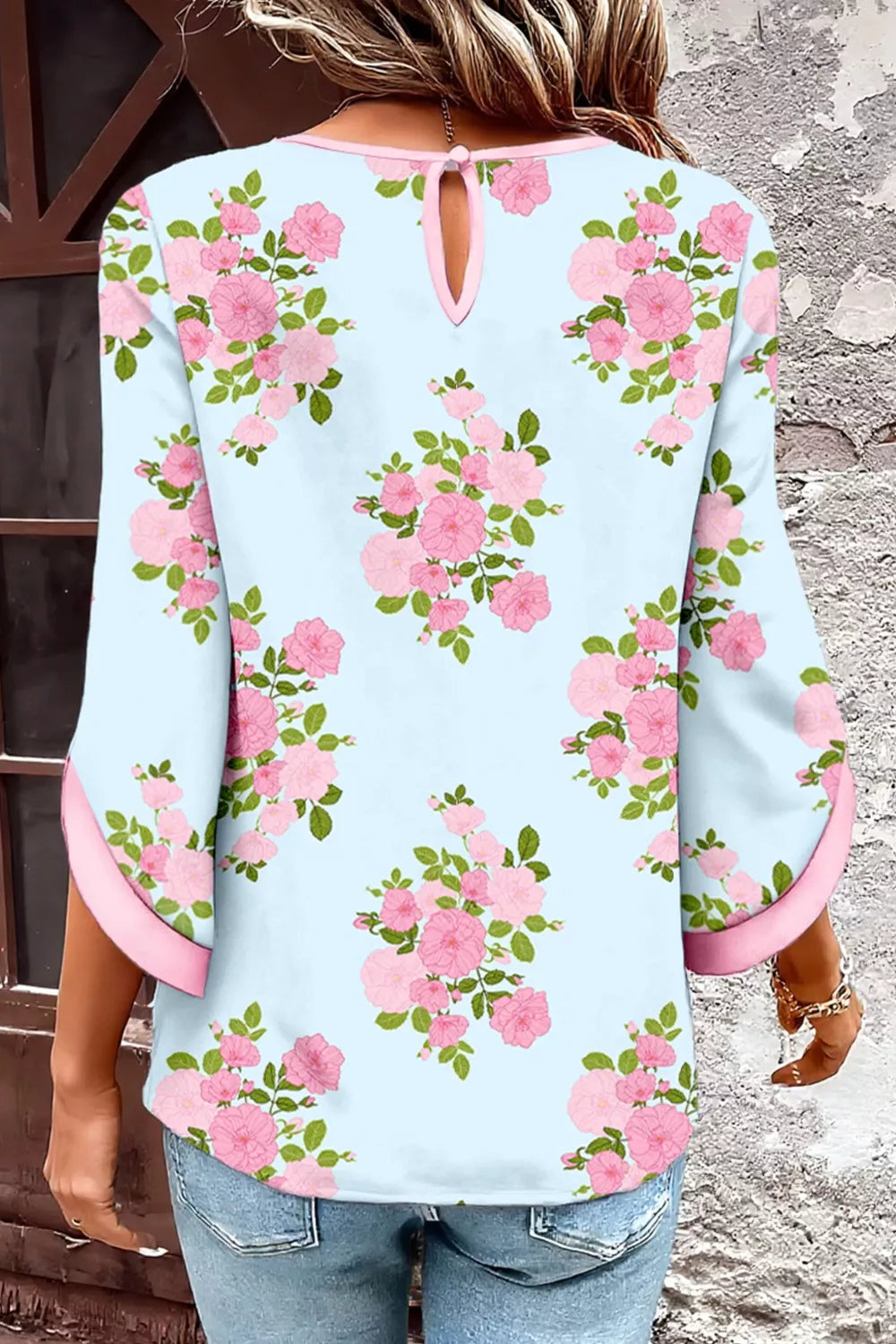 powder blue floral blouse with pink rose print and button sleeve details in a romantic boho style