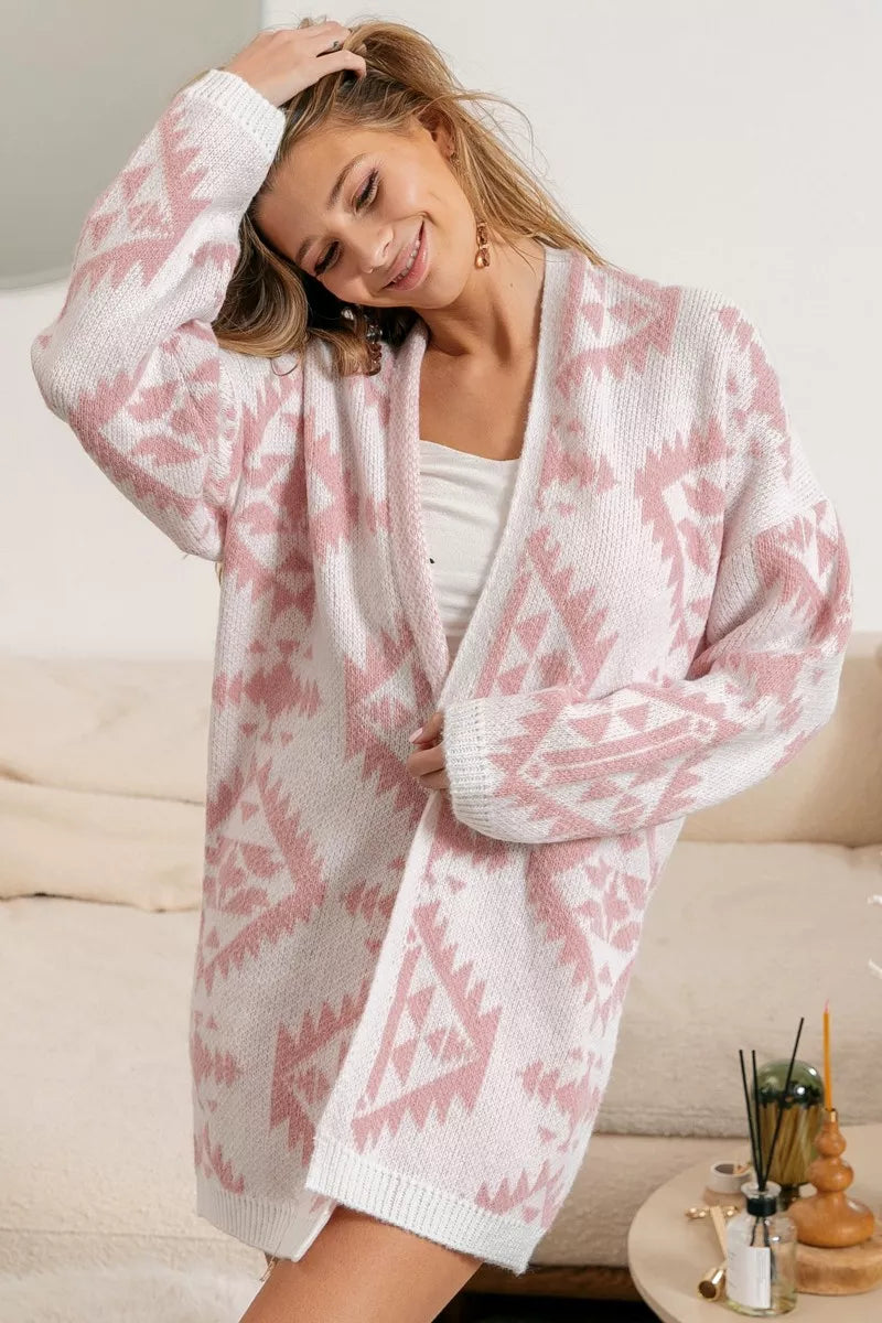 Model wearing Blush Horizons Cardigan in soft pink with Aztec pattern and open front design
