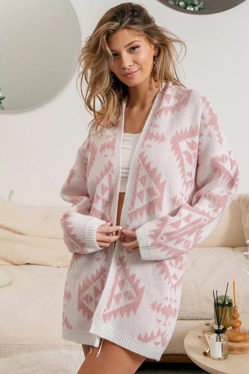 Model wearing Blush Horizons Cardigan in soft pink with Aztec pattern and open front design