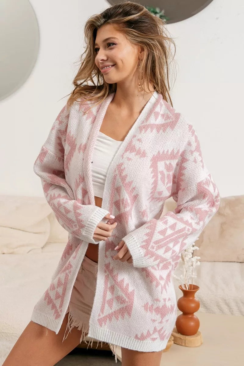 Model wearing Blush Horizons Cardigan in soft pink with Aztec pattern and open front design