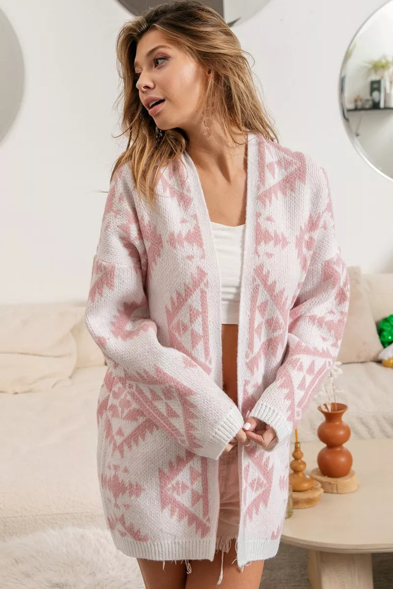 Model wearing Blush Horizons Cardigan in soft pink with Aztec pattern and open front design