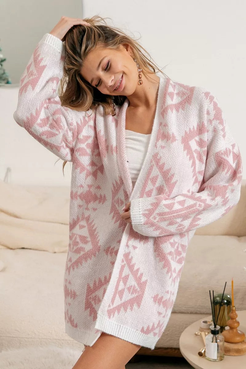 Model wearing Blush Horizons Cardigan in soft pink with Aztec pattern and open front design