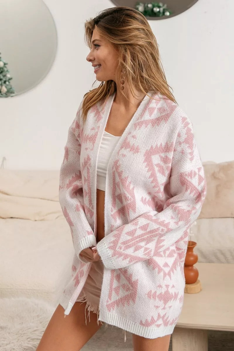 Model wearing Blush Horizons Cardigan in soft pink with Aztec pattern and open front design