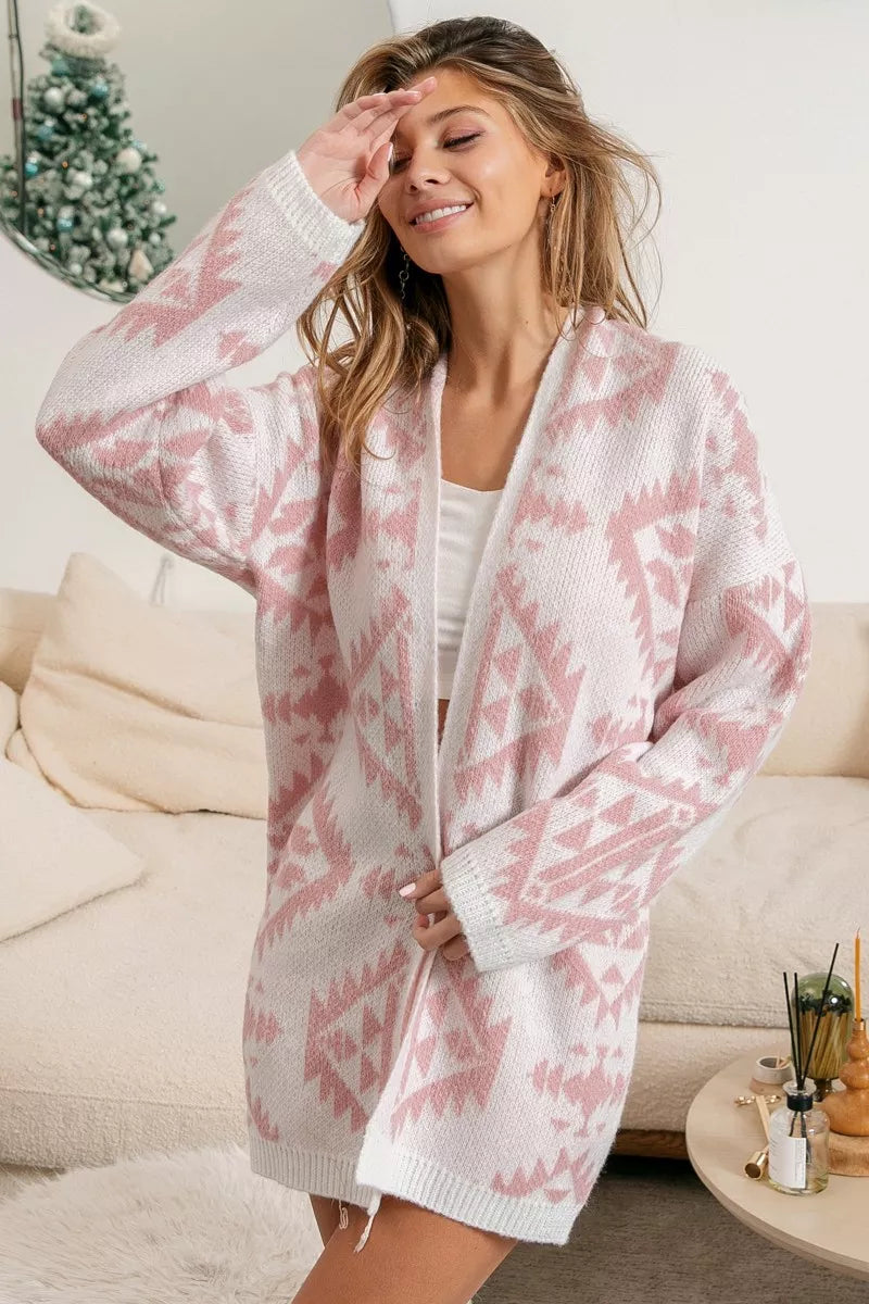 Model wearing Blush Horizons Cardigan in soft pink with Aztec pattern and open front design