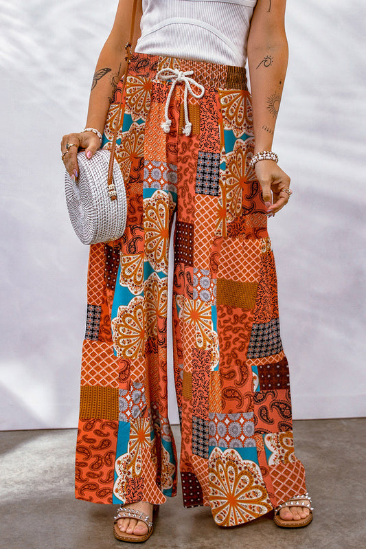 Bohemian patchwork drawstring wide leg pants in orange – casual chic boho trousers with multicolored design.