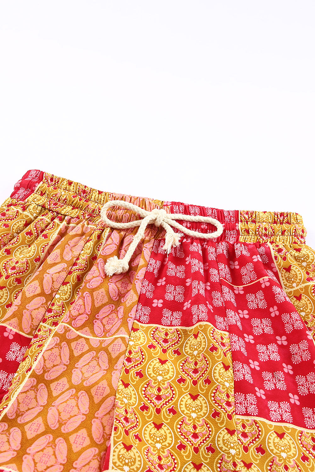 Bohemian patchwork drawstring wide leg pants in red – flowy festival-ready boho style trousers.