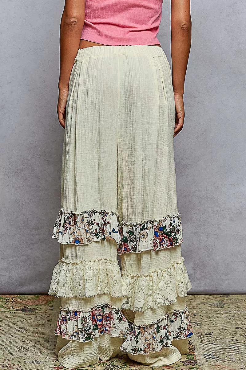 Wide-leg cotton pants with lace and floral tiered ruffles, drawstring waistband, and bohemian style
