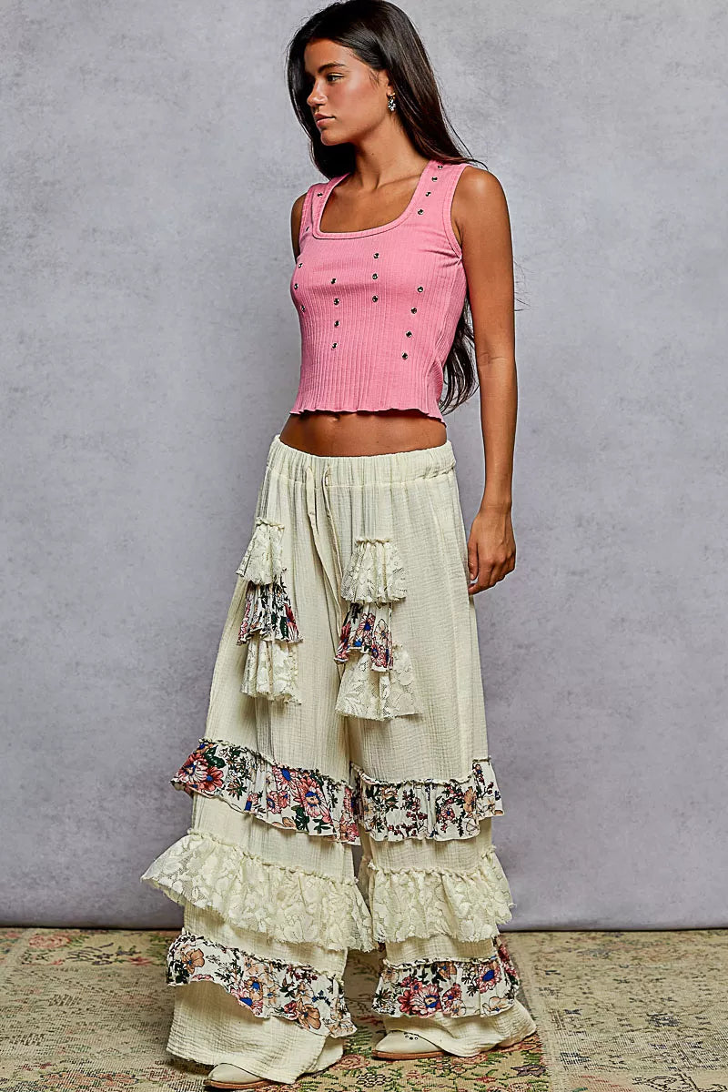 Wide-leg cotton pants with lace and floral tiered ruffles, drawstring waistband, and bohemian style